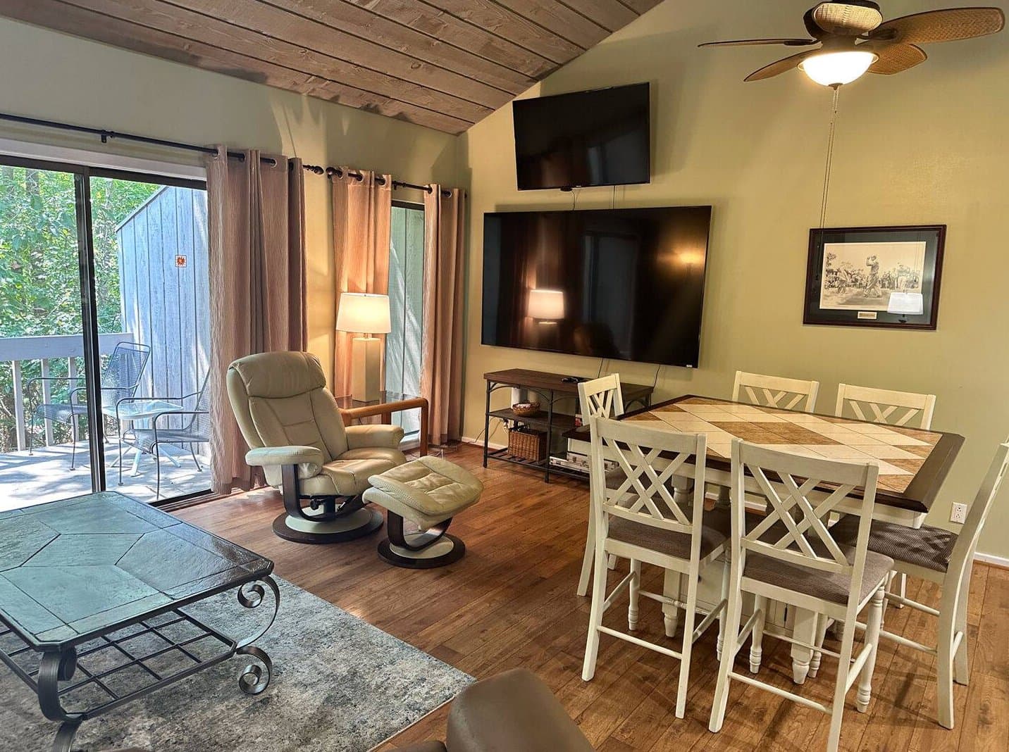 85-inch TV and dining area with kitchen view